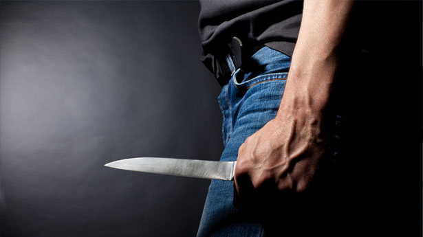 Man-holding-a-knife-via-Shutterstock